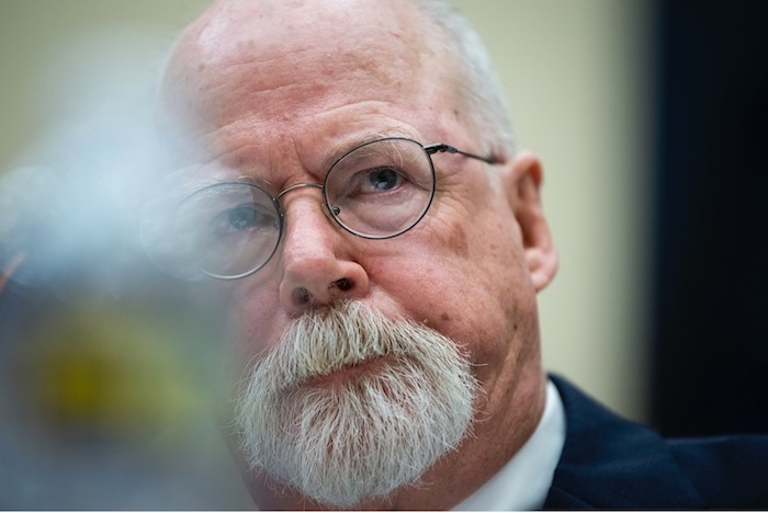 Close-up of John Durham wearing glasses during congressional testimony