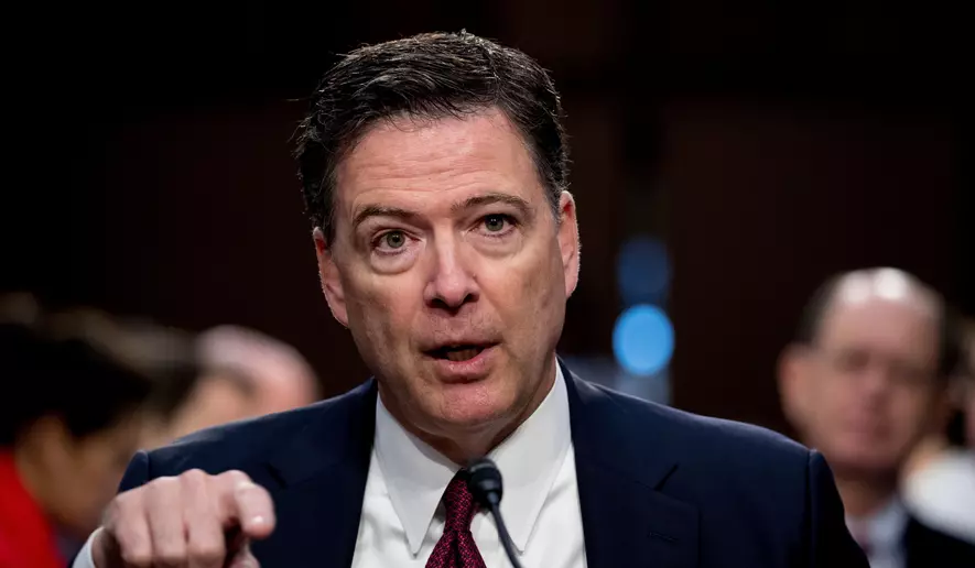 James Comey pointing while testifying at a congressional hearing