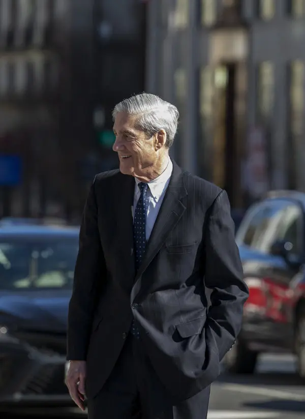 Robert Mueller walking outside on a Washington, D.C. street