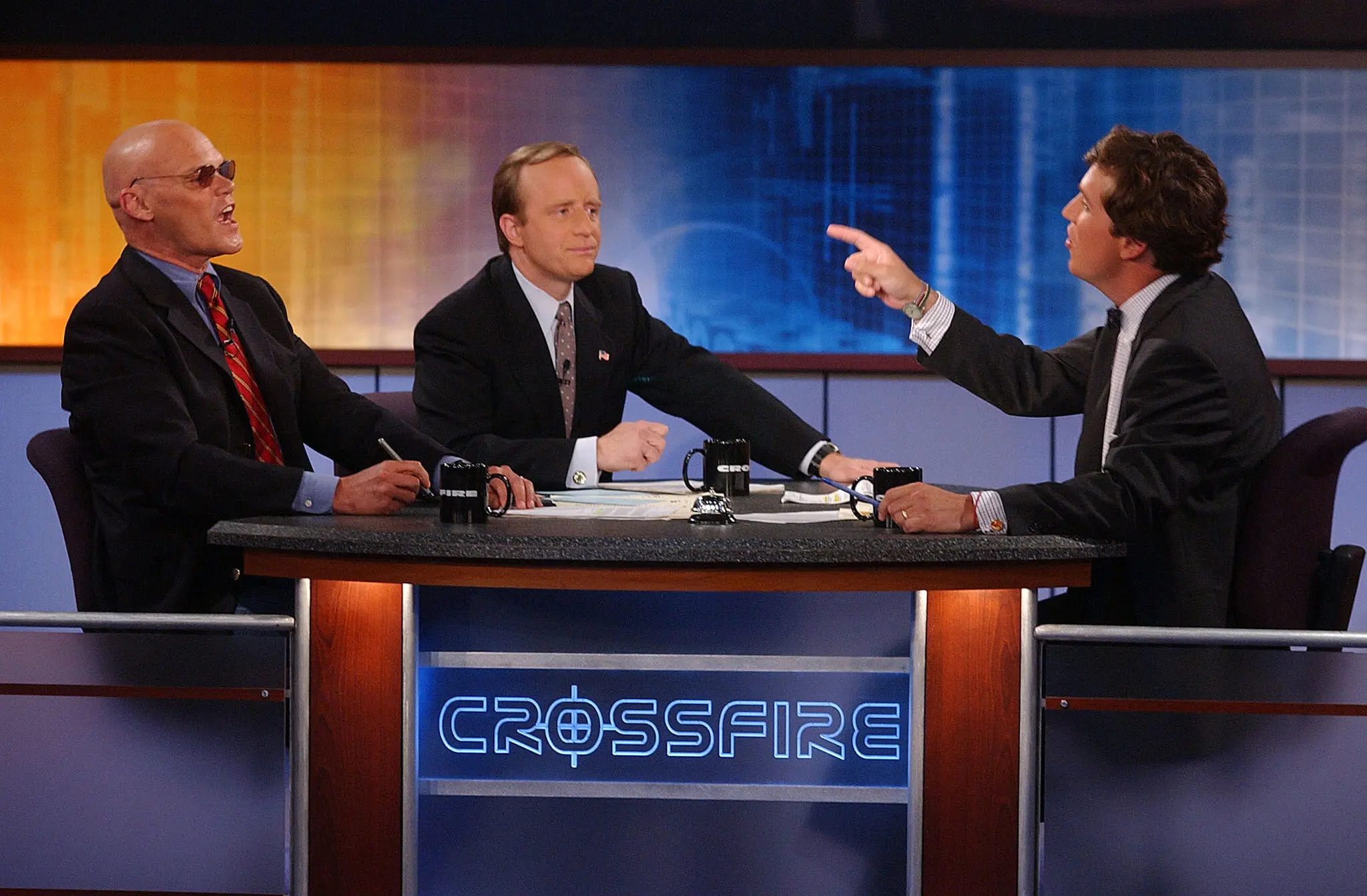 Tucker Carlson on the set of CNN's Crossfire with James Carville and Paul Begala