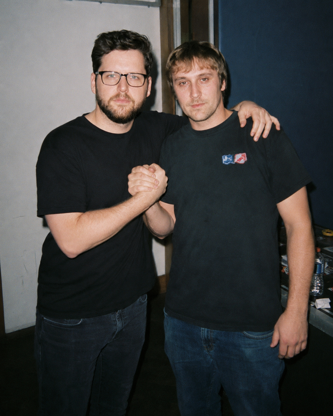 Michael Mendy and Robbie Bizzle posing together backstage